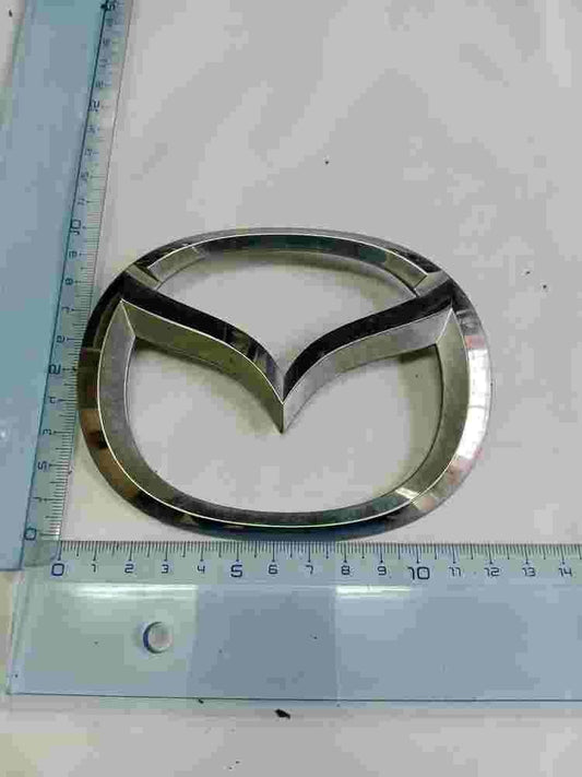Emblem   Mazda 2 II Demio 11.5cm D65151730 D651-51-730