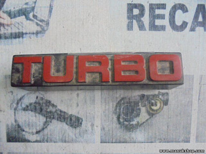 Emblem Logo Nissan Terrano WD21 Ford Maverick TURBO 6289785G10